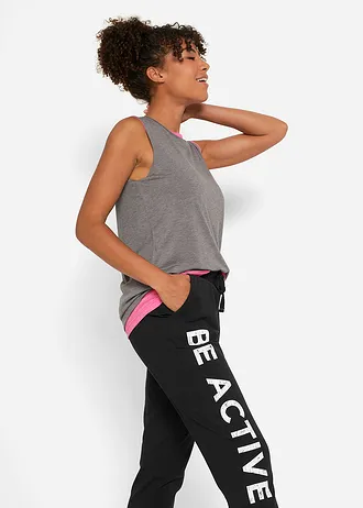 Spodnie sportowe bawełniane z nadrukiem, Loose Fit • czarno-biały • sklep bonprix