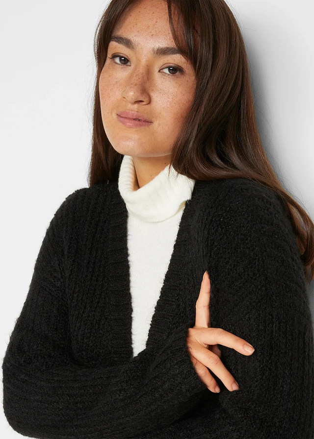 Lang gebreid vest • zwart • product-page.page-title-suffix