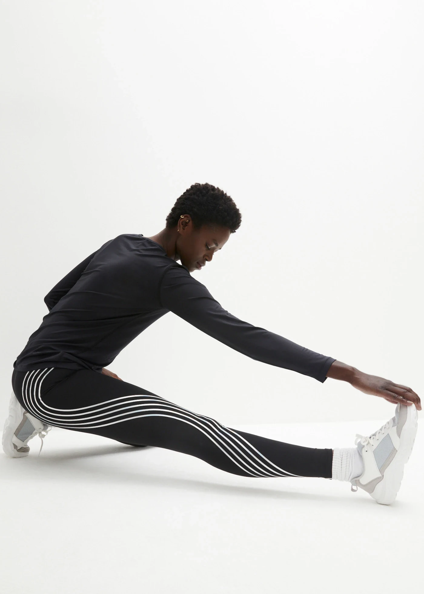 Cropped thermo sportlegging met reflecterende details • zwart • bonprix online shop