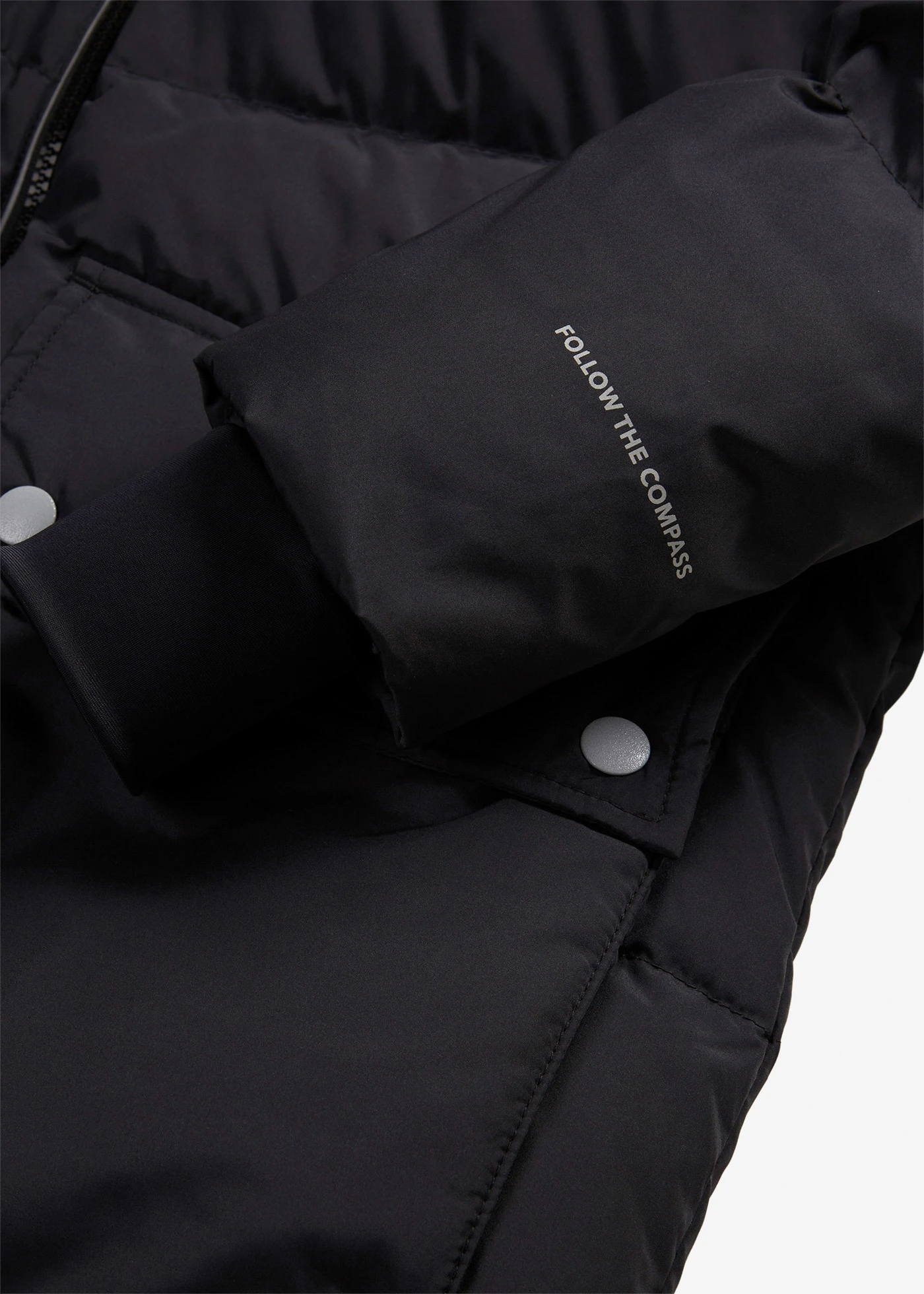 Lange waterafstotende donsjas met reflecterende details • zwart • bonprix online shop