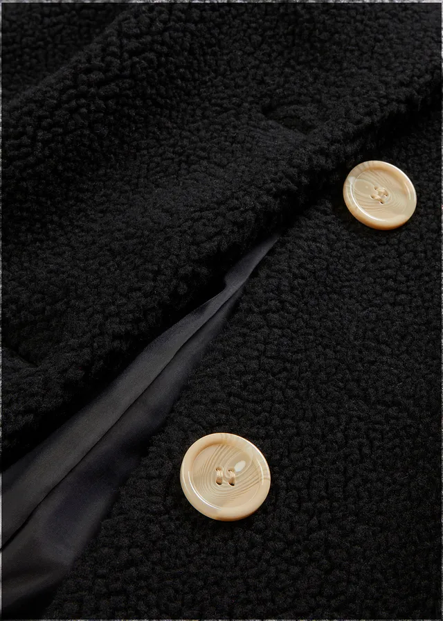 Manteau en sherpa avec capuche et poches • noir • product-page.page-title-suffix