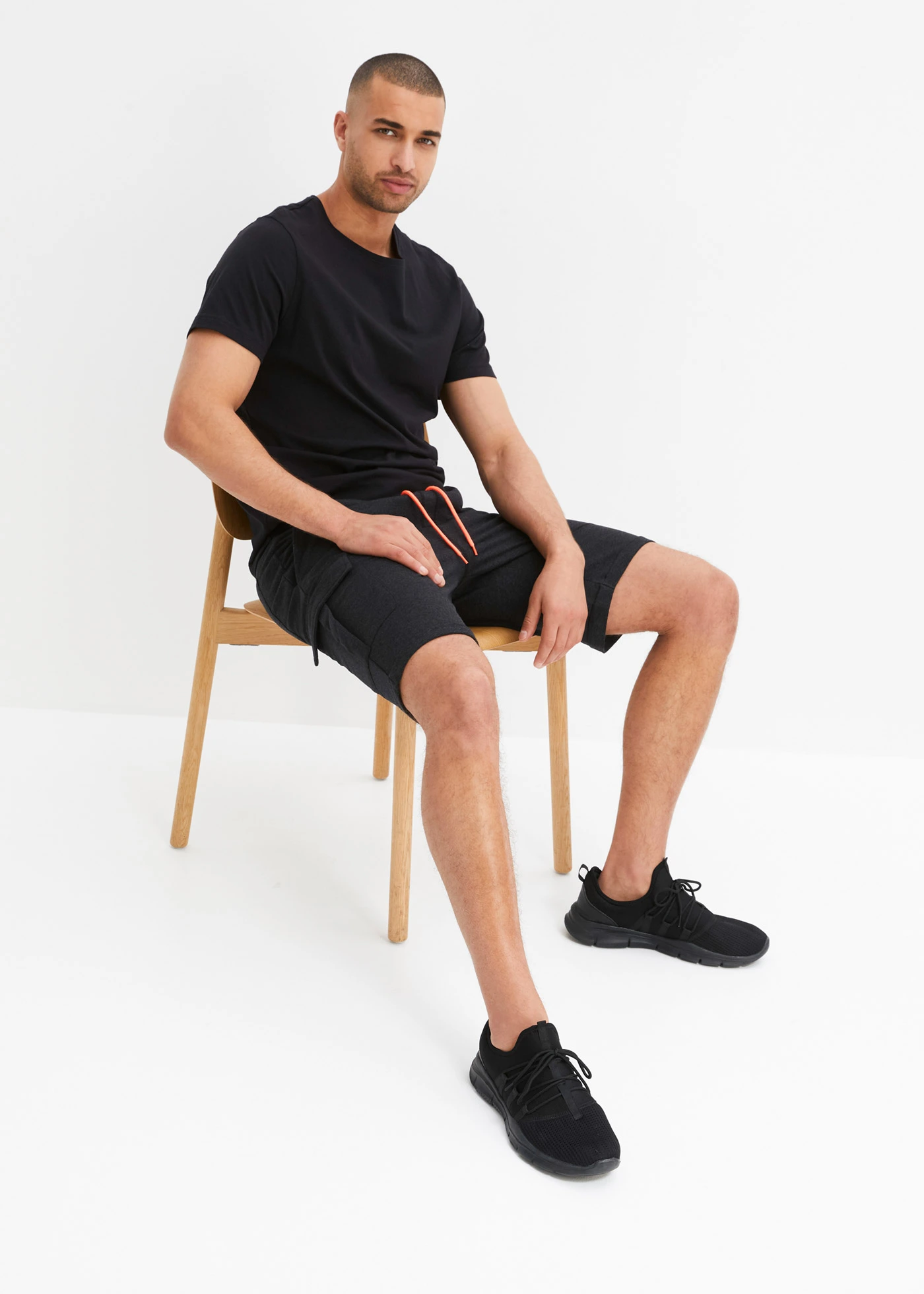 Teplákové cargo bermudy • černo-neonově lososový melír • bonprix obchod