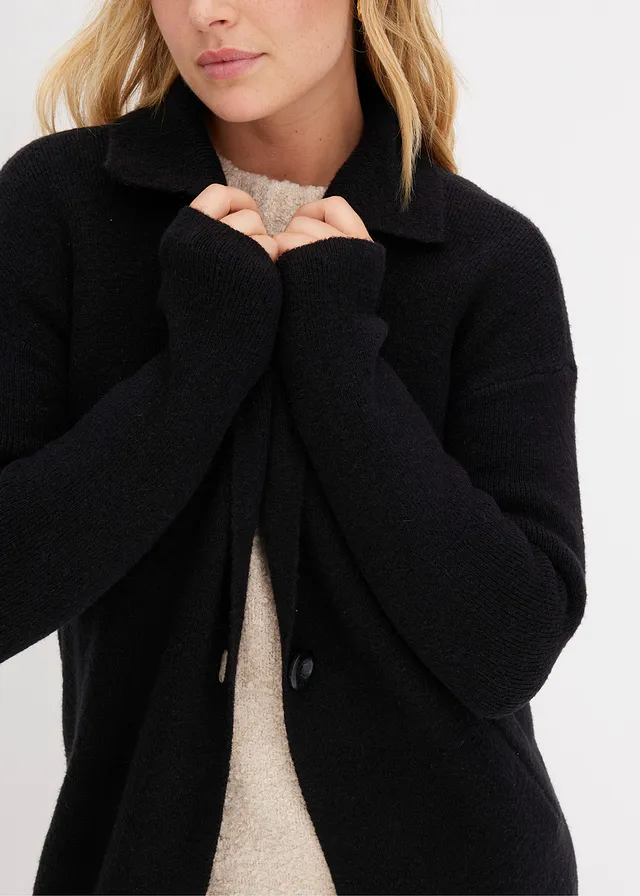 Lang gebreid vest • zwart • product-page.page-title-suffix