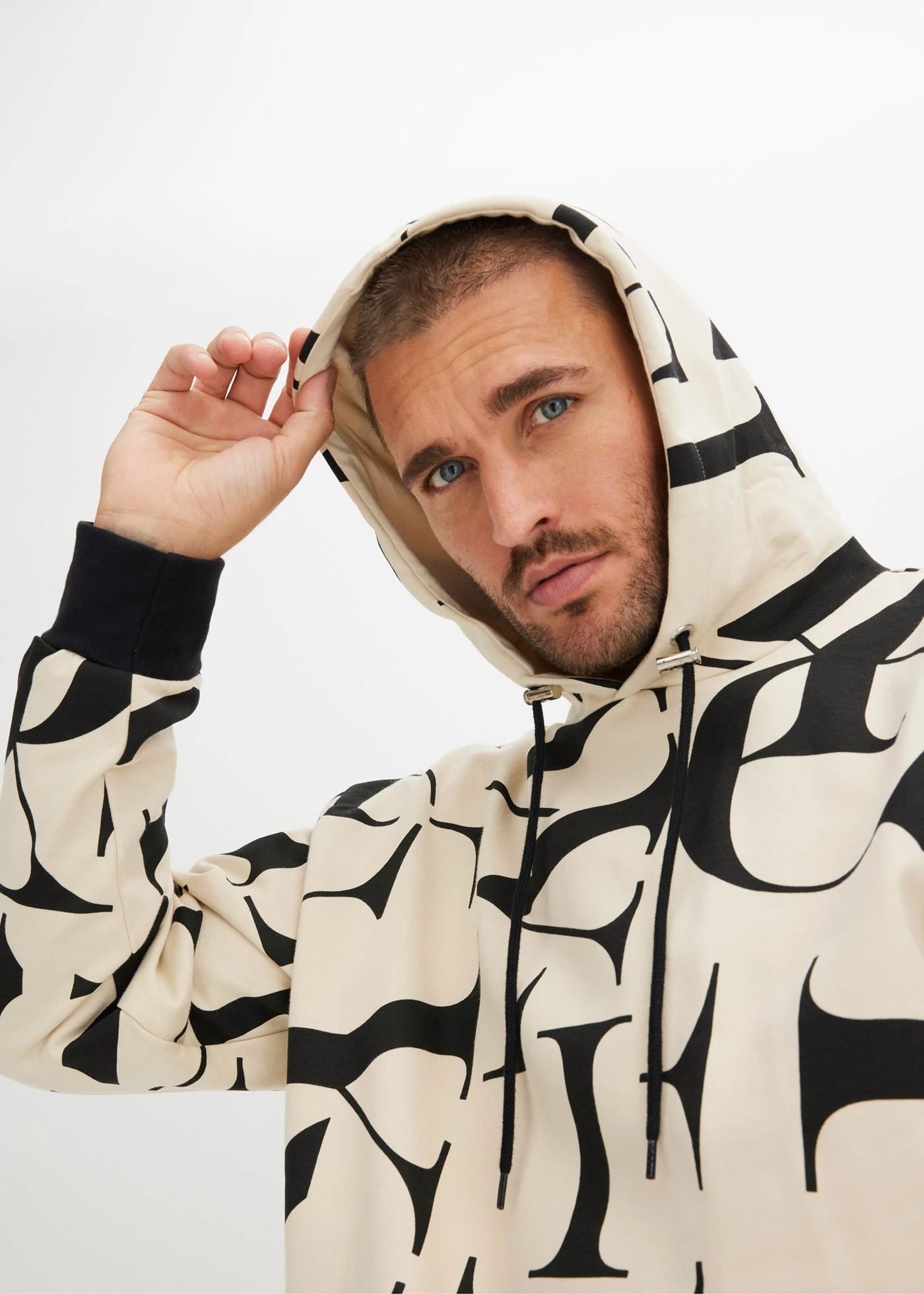 Sweat à capuche 100% coton, coupe loose • sable clair-noir • Boutique bonprix