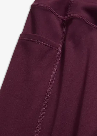 Colanți sport comozi cu uscare rapidă, cu buzunar pentru mobil • mov întunecat • magazin bonprix