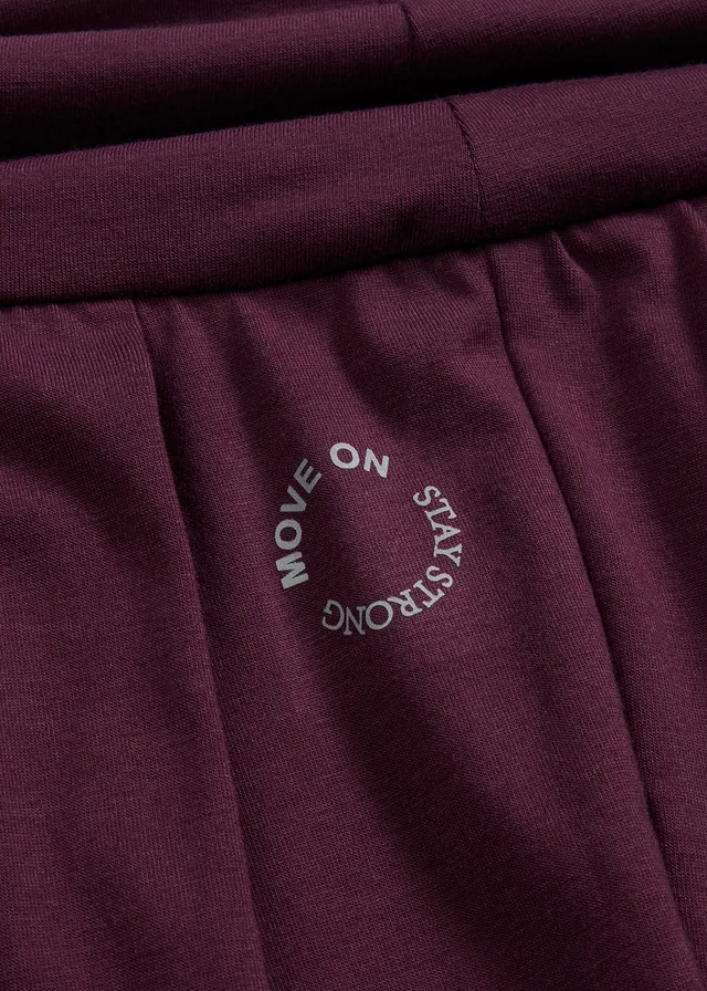 Pantaloni sport largi cu bată ce poate fi răsucită • mov întunecat • magazin bonprix