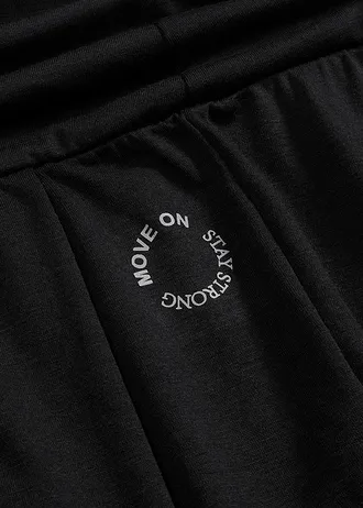 Szerokie spodnie sportowe z wywijanym paskiem • czarny • sklep bonprix