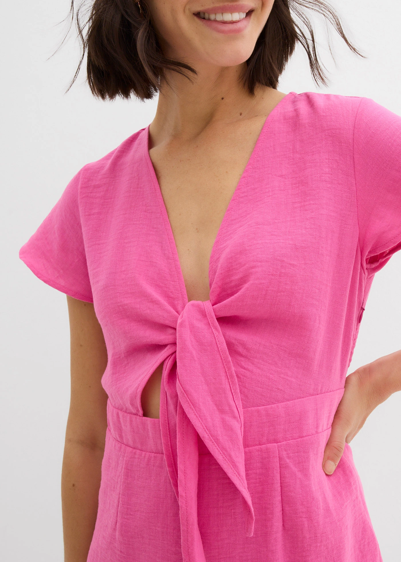 Mini jurk met een knoop onder aan de V-haks • lichtfuchsia • bonprix online shop