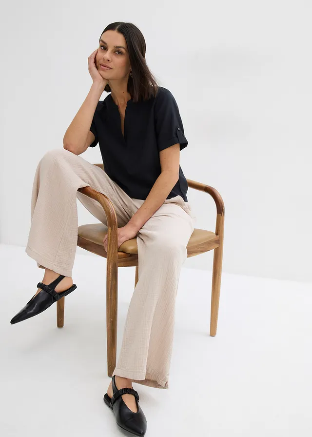 Blouse met korte mouwen van een soepele viscosemix • zwart • product-page.page-title-suffix