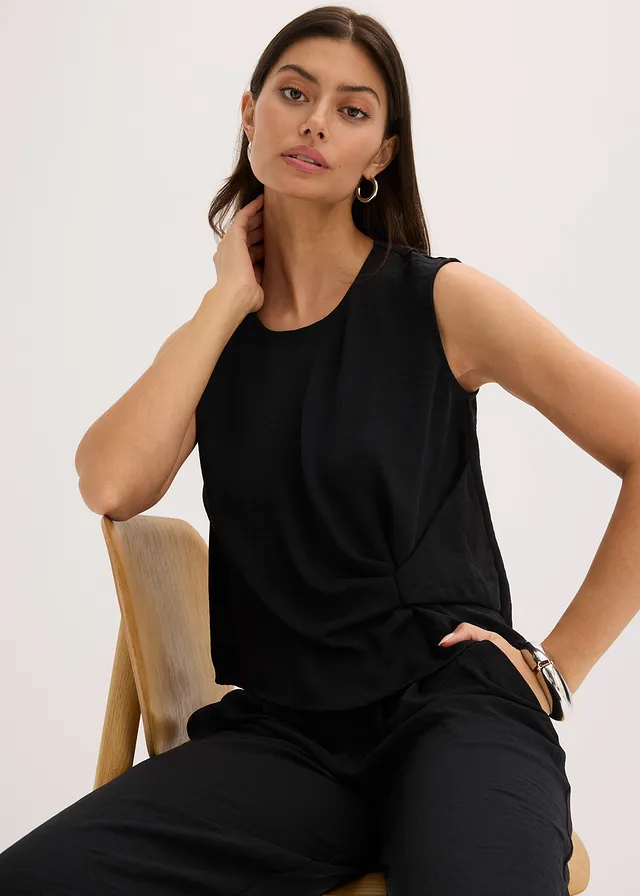 Mouwloze bloes met knoop • zwart • product-page.page-title-suffix