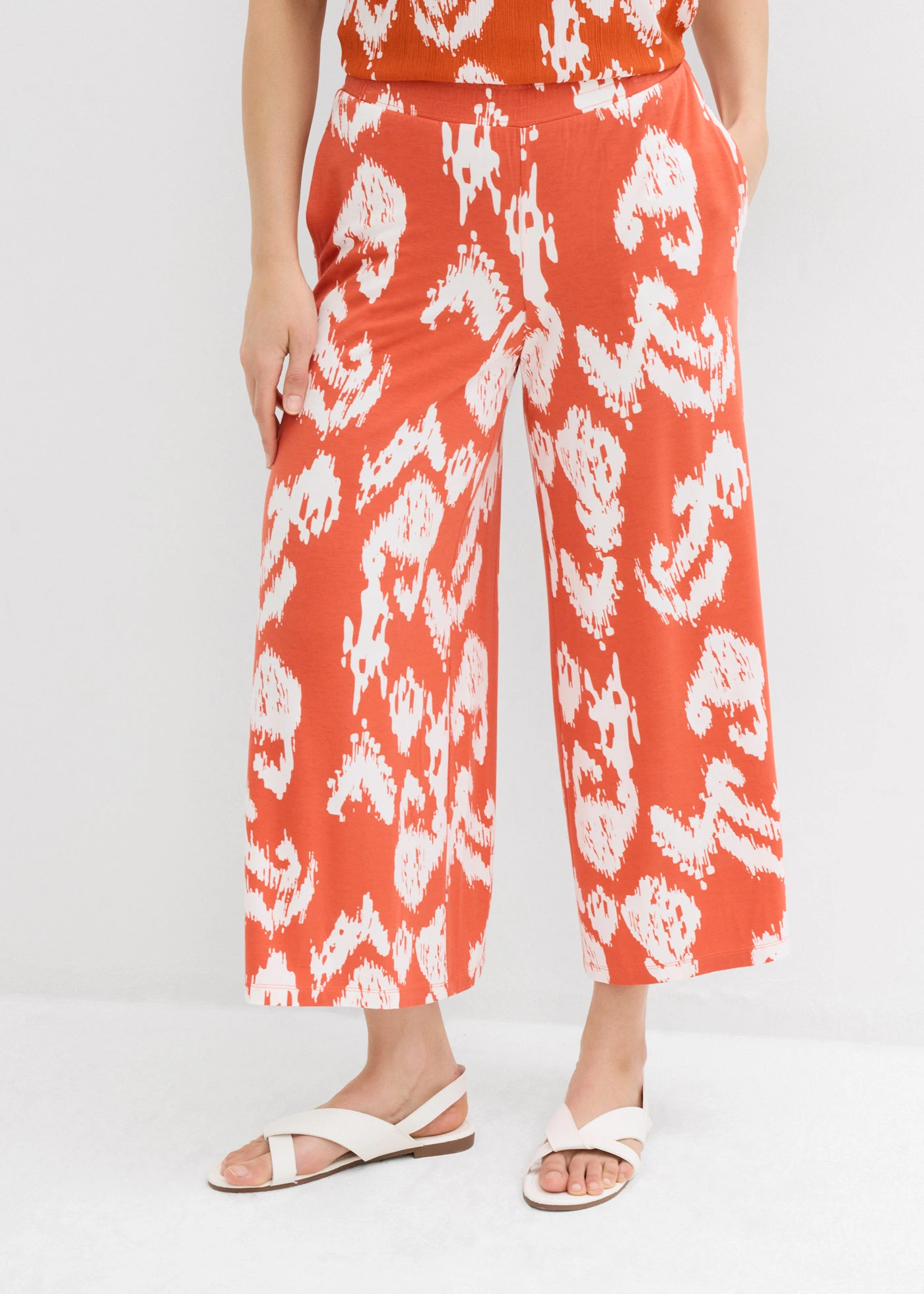 Žerzejové kalhoty z viskózové směsi • skořicově červená-přírodní bílá • bonprix obchod