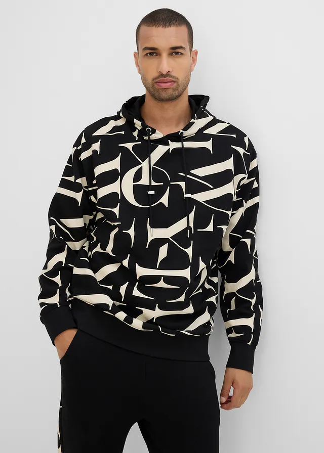 Sweat à capuche 100% coton, coupe loose, Couleur: noir/sable clair imprimé