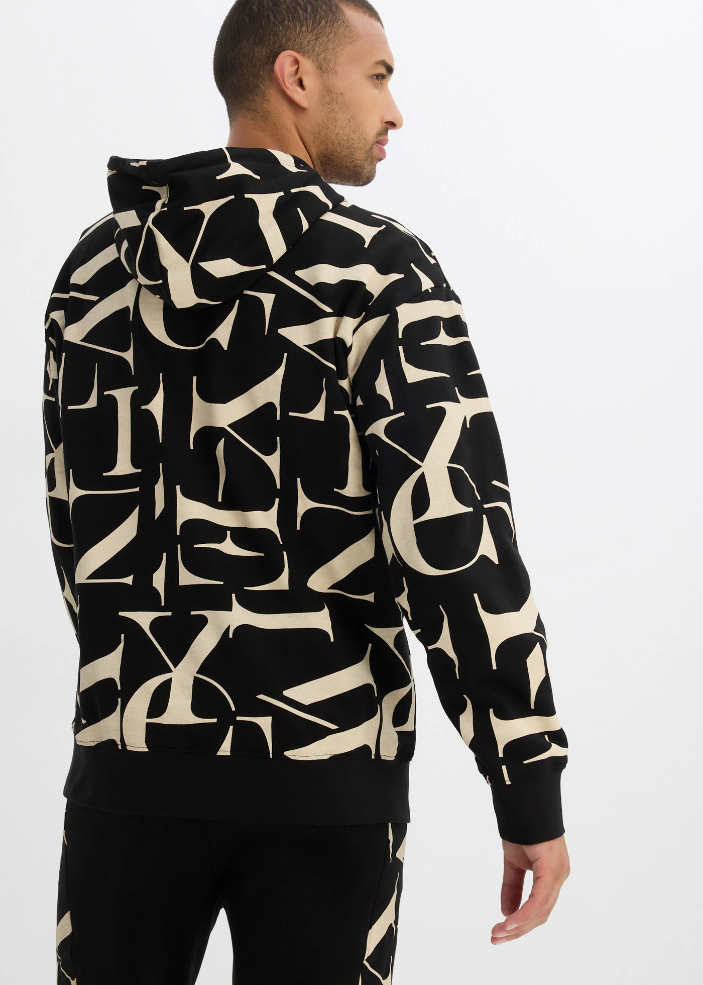 Sweat à capuche 100% coton, coupe loose • noir-sable clair imprimé • Boutique bonprix