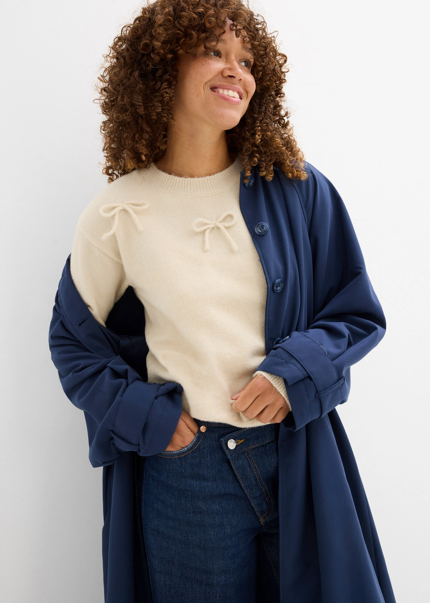 Pull avec nœuds • sable clair chiné • Boutique bonprix