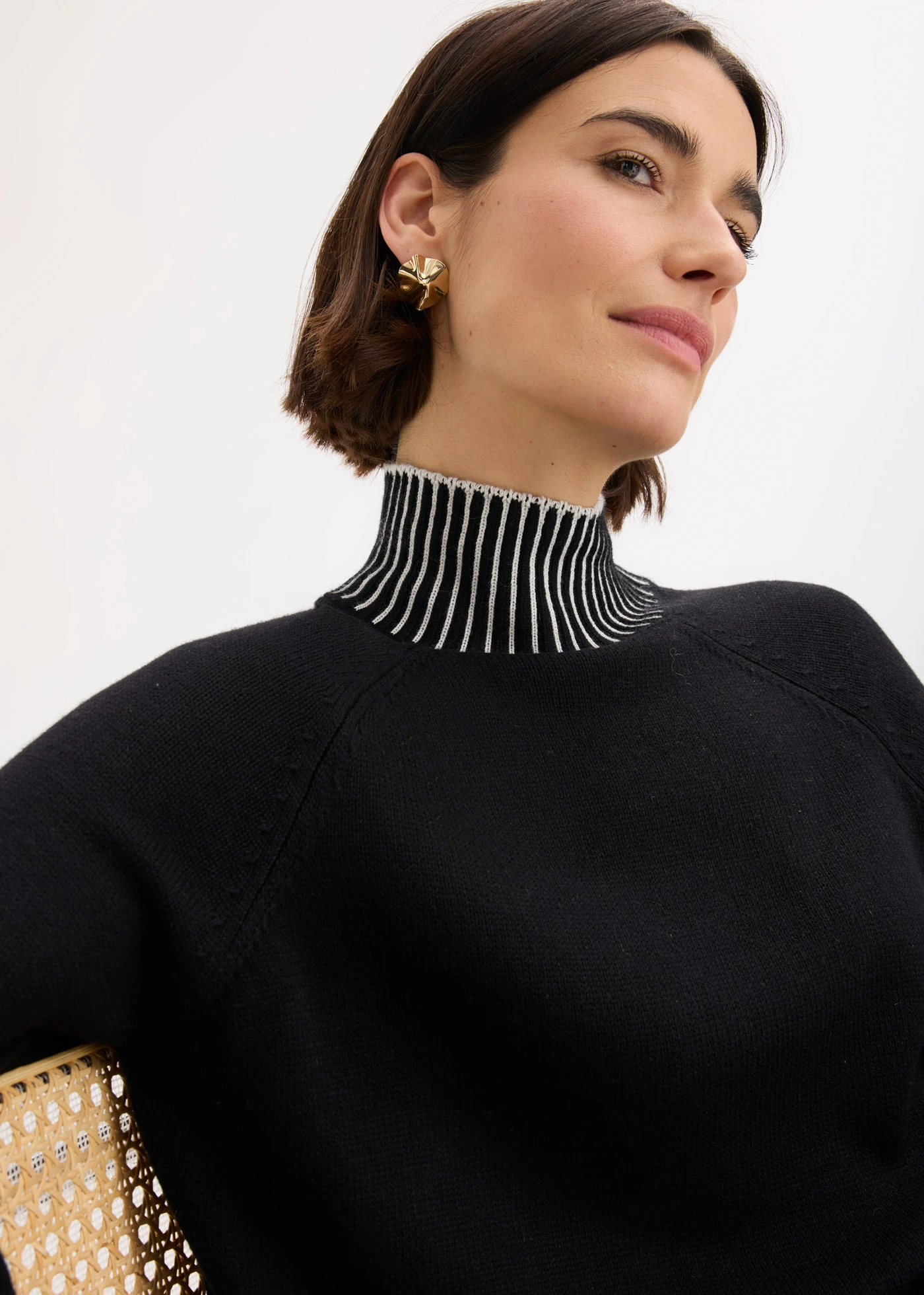 Pulóver álló gallérral és kasmírral • fekete-natúrbézs • bonprix áruház