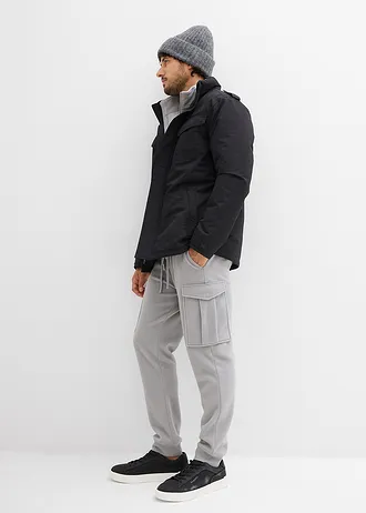 Nepromokavá funkční bunda se srolovatelnou kapucí a nárameníky • černá • bonprix obchod