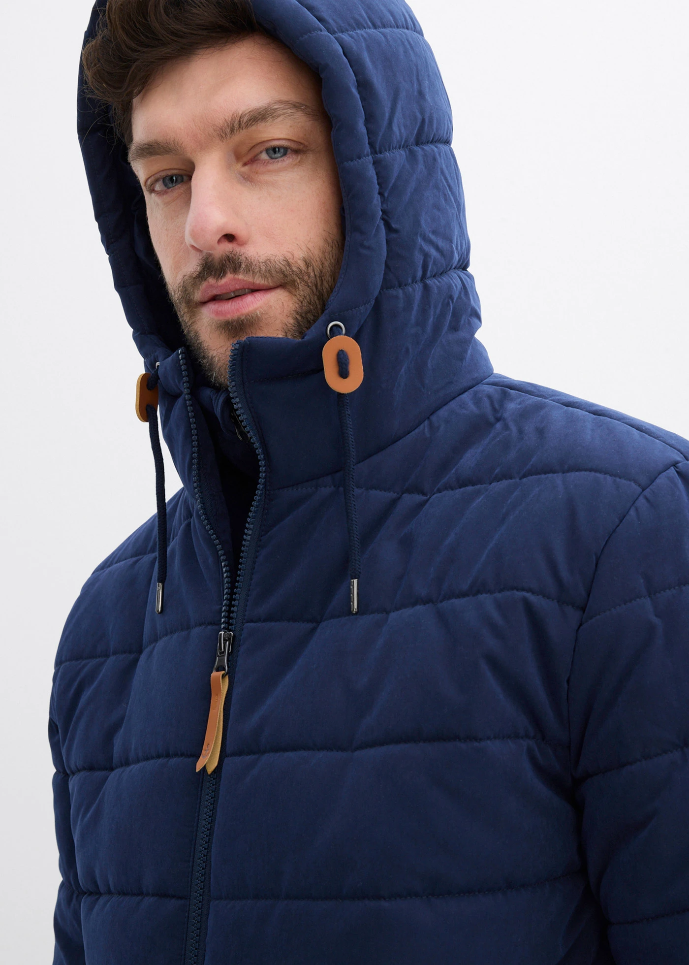 Lange, gewatteerde jas met capuchon • donkerblauw • bonprix online shop