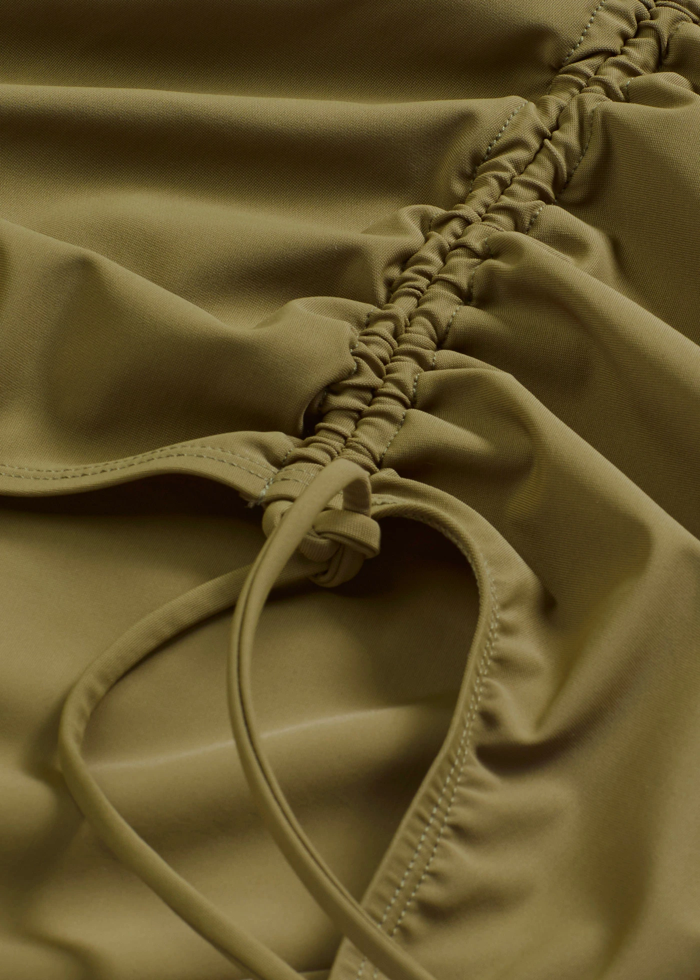 Corrigerend badpak met strikkoordjes, licht corrigerend • donkerolijfgroen • bonprix online shop