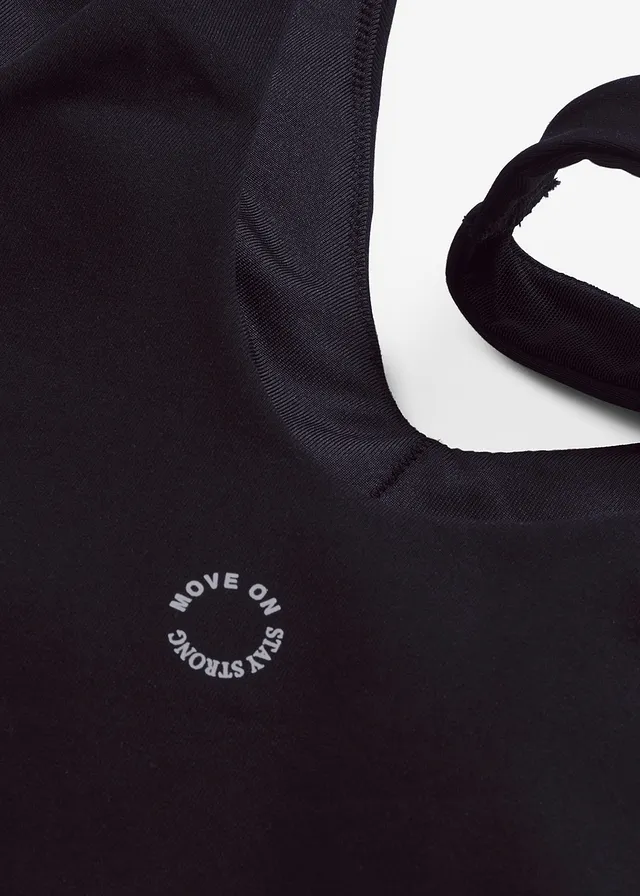 Top de sport avec soutien-gorge intégré, maintien modéré et toucher coton • noir • product-page.page-title-suffix