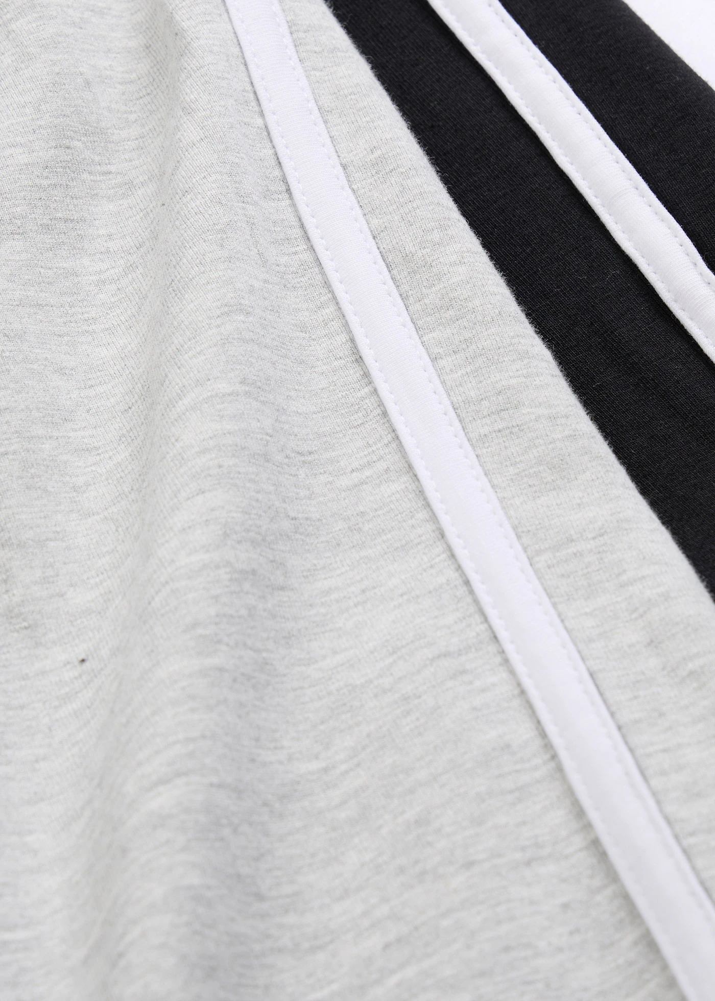 Lot de 2 pantalons en jersey de coton extensible • noir+gris clair chiné • Boutique bonprix