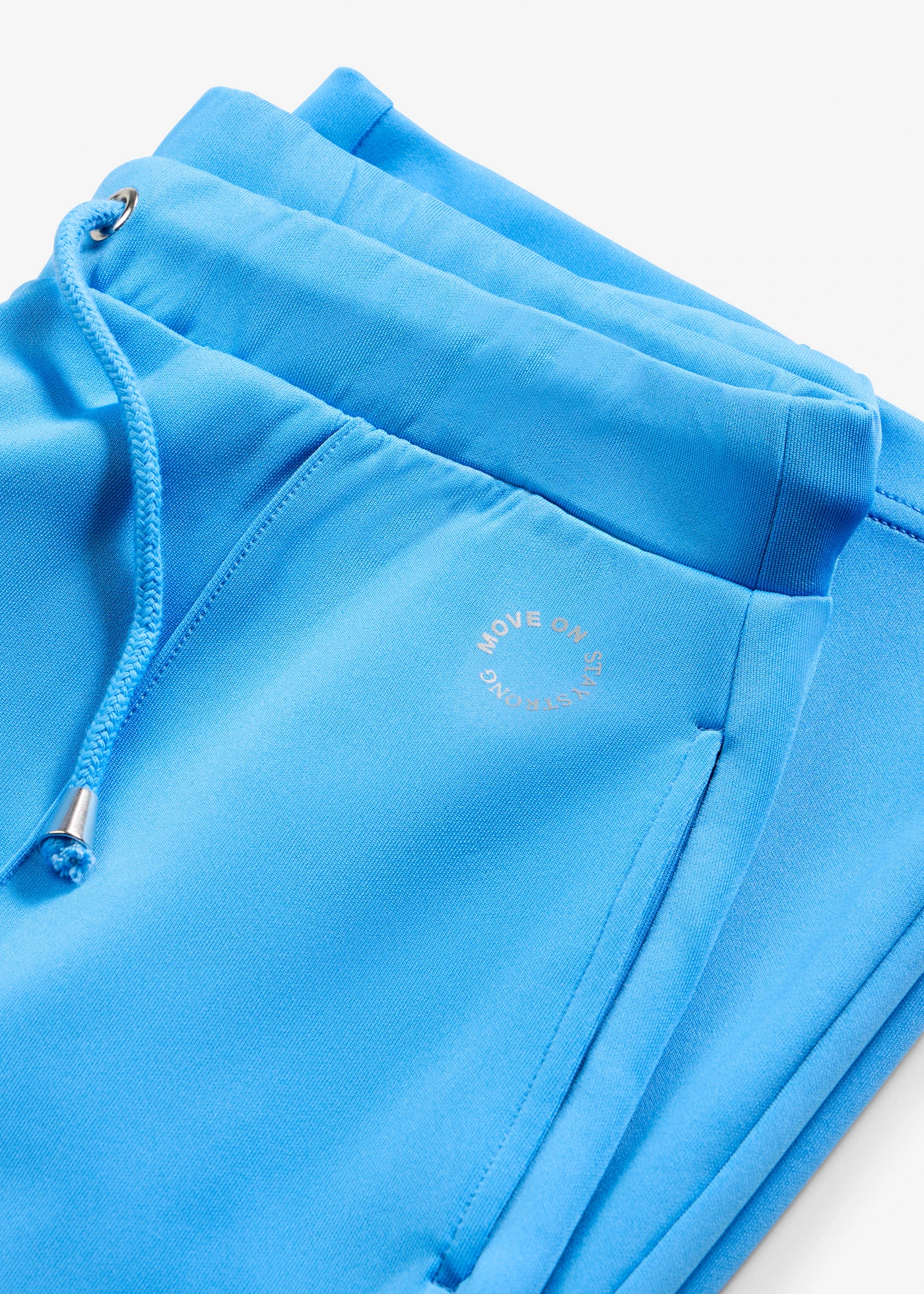 Spodnie sportowe z ozdobnymi szwami • niebieski brylantowy • sklep bonprix