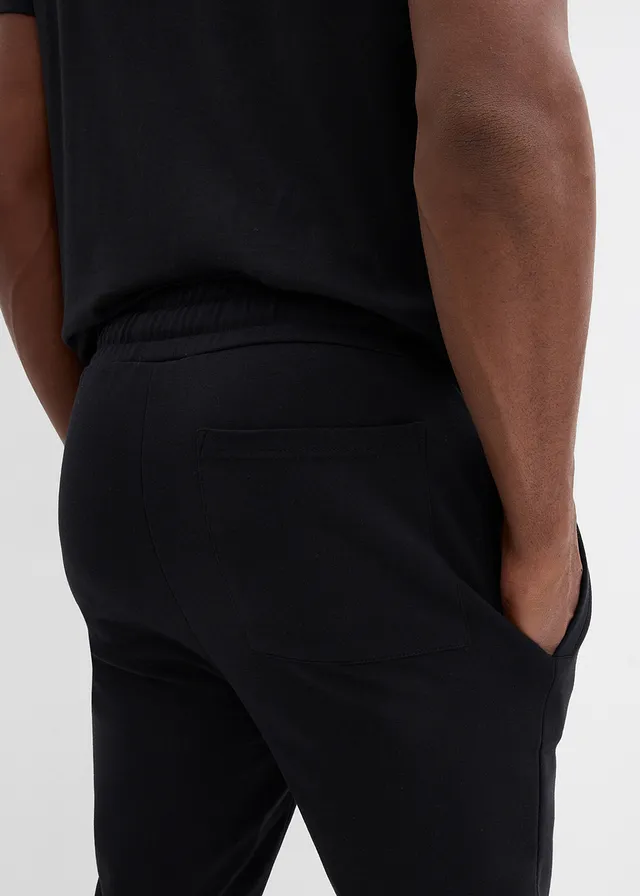 Joggingové kalhoty s kontrastními detaily • černá • bonprix obchod