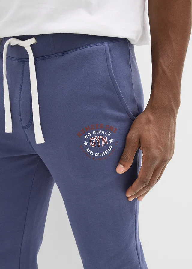 Spodnie sportowe ze sportowymi detalami • indygo • sklep bonprix