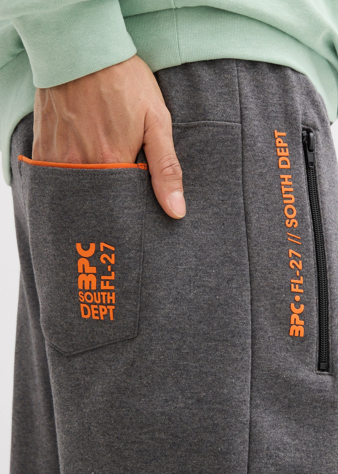 Joggingové kalhoty s kapsami na zip • šedý melír • bonprix obchod