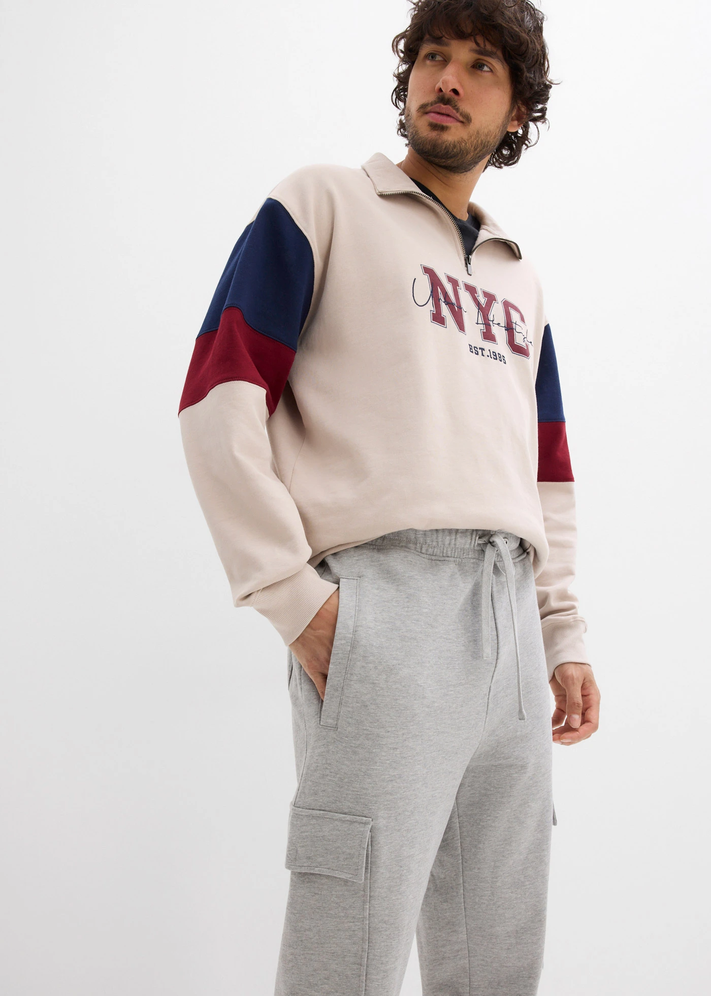 Pantaloni de jogging cu buzunare cargo, Loose Fit • gri deschis melanj • magazin bonprix