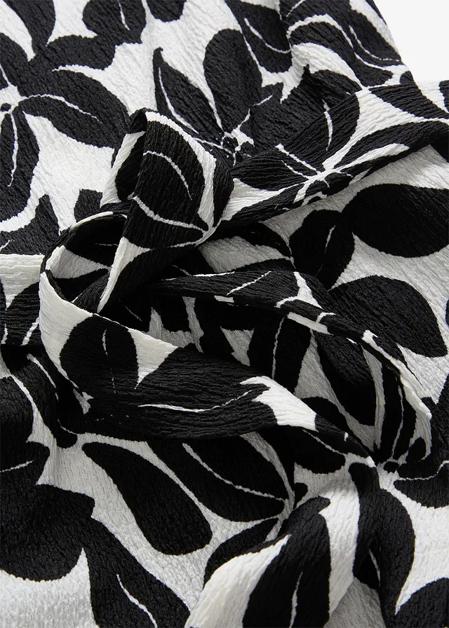 Jersey jumpsuit • crème-zwart • product-page.page-title-suffix