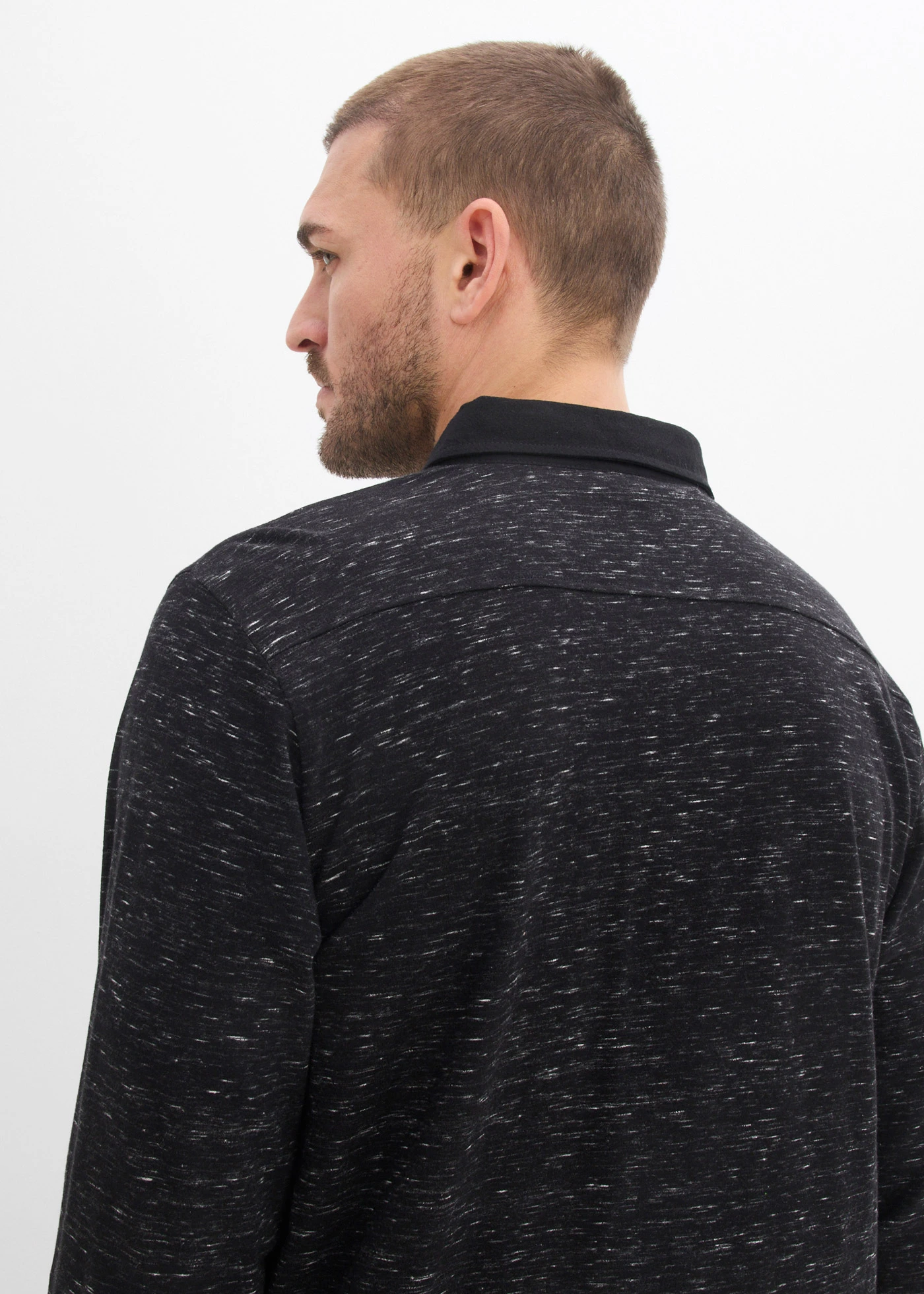 Polo manches longues à col tissé • noir chiné • Boutique bonprix