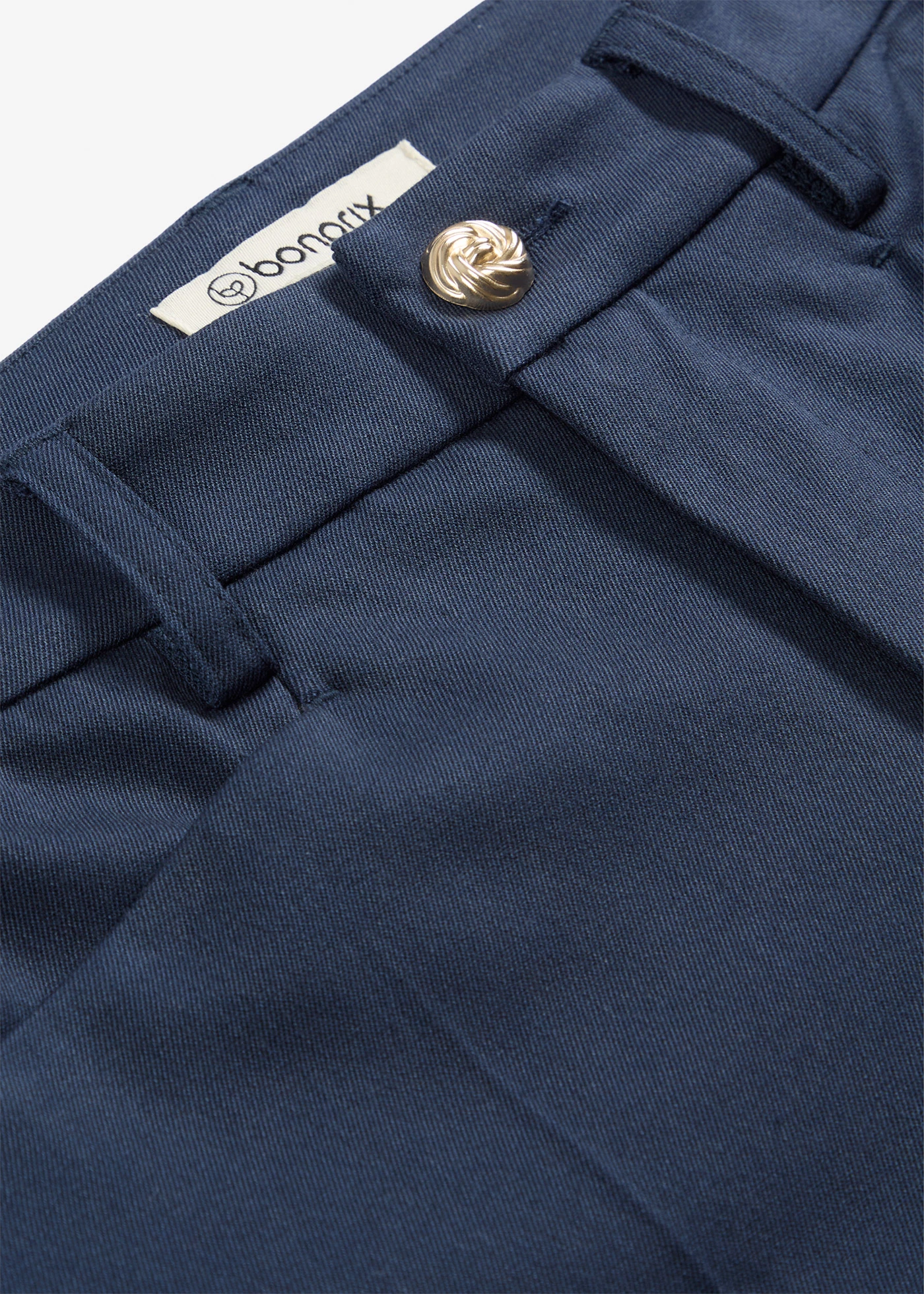 Pantaloni 7/8 evazați cu nasture decorativ • bleumarin • magazin bonprix