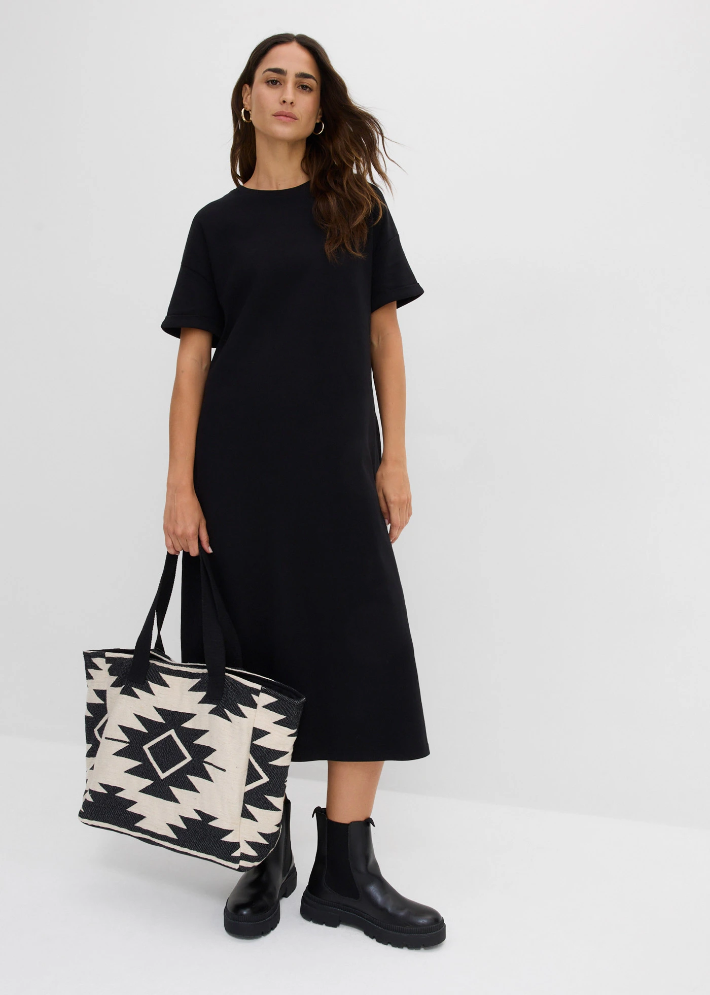 Rochie tricot din material interlock mai robust, cu buzunare • negru • magazin bonprix