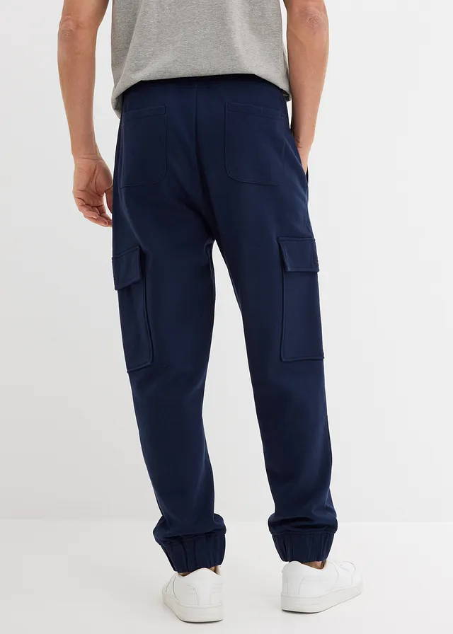 Spodnie sportowe z kieszeniami cargo, loose fit • granatowy • sklep bonprix