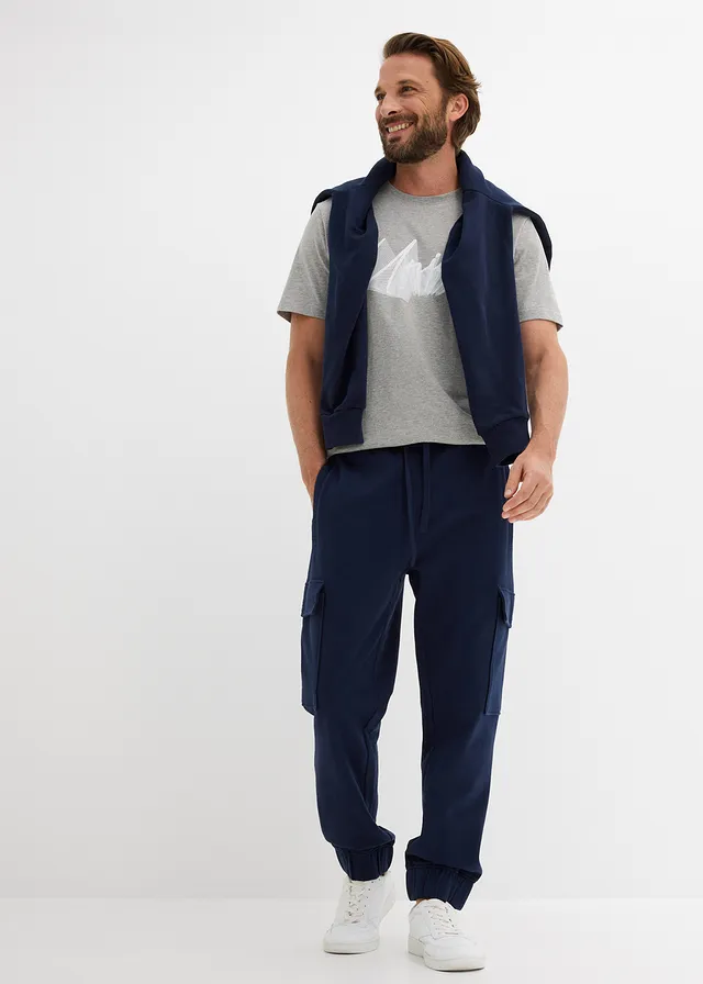 Spodnie sportowe z kieszeniami cargo, loose fit • granatowy • sklep bonprix