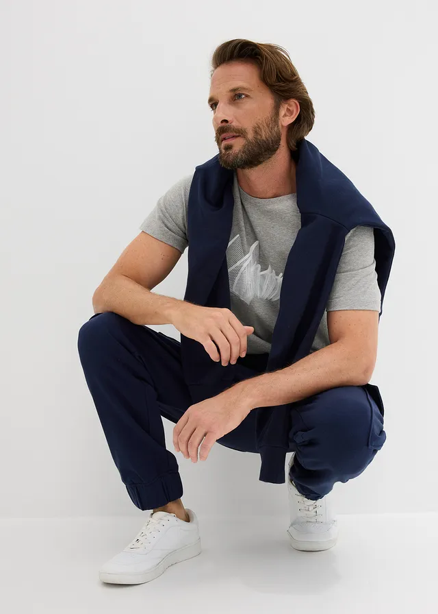 Spodnie sportowe z kieszeniami cargo, loose fit • granatowy • sklep bonprix