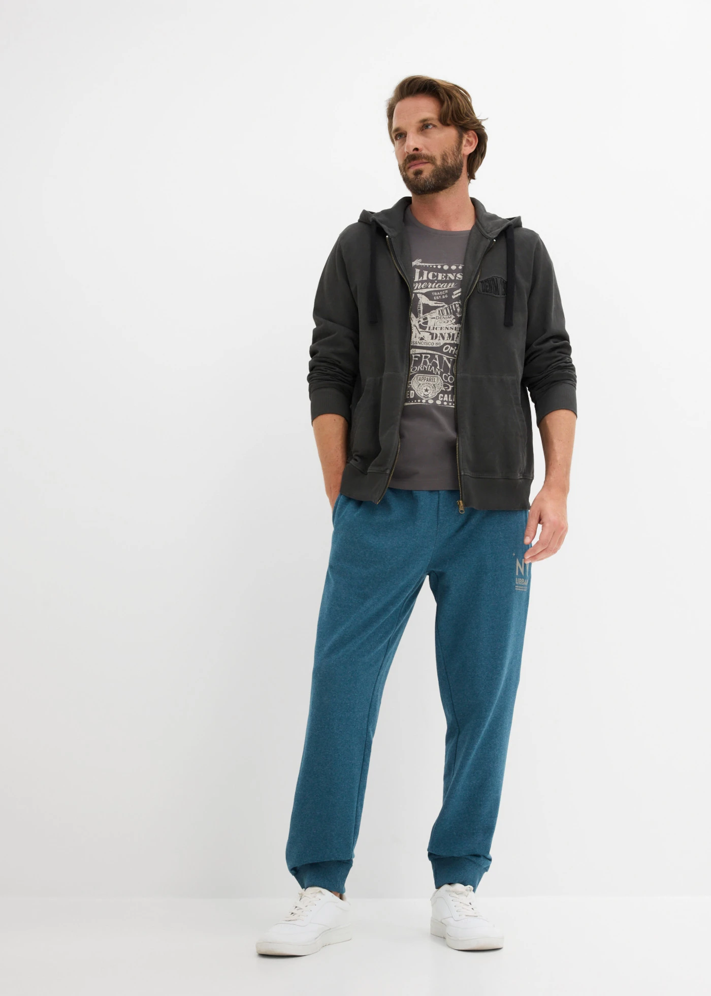 Pantalon de jogging à détails contrastants • pétrole/gris terre d’ombre chiné • Boutique bonprix