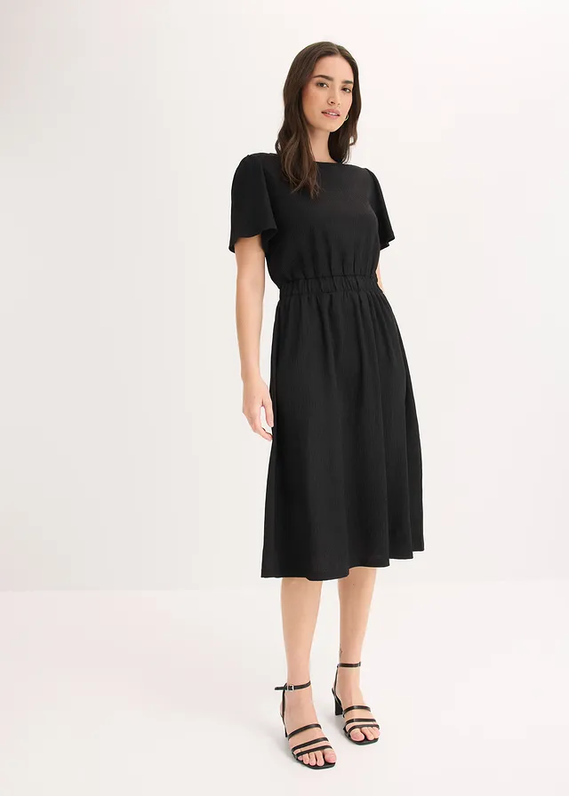 Uitlopende jersey jurk • zwart • product-page.page-title-suffix