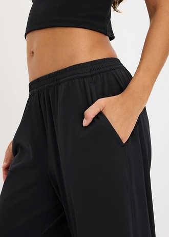 Pantaloni sport comozi cu croială largă pe picior și uscare rapidă • negru • magazin bonprix