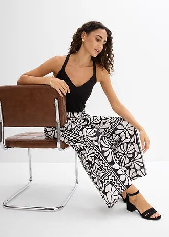 Salopetă din jerse • negru cu imprimeu • magazin bonprix