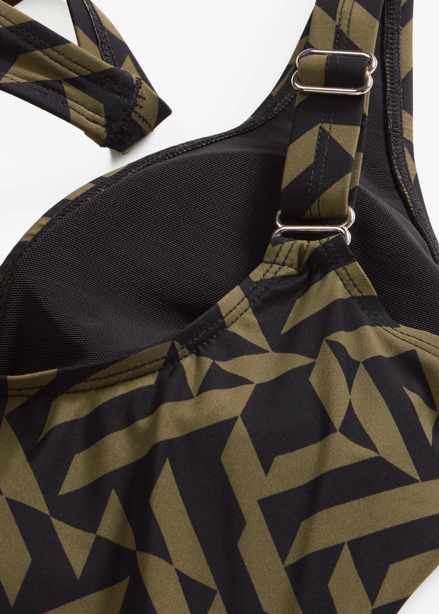 Stahovací jednodílné plavky, lehký tvarující efekt, s výstřihem do V • černo-tmavě olivová s grafickým vzorem • bonprix obchod