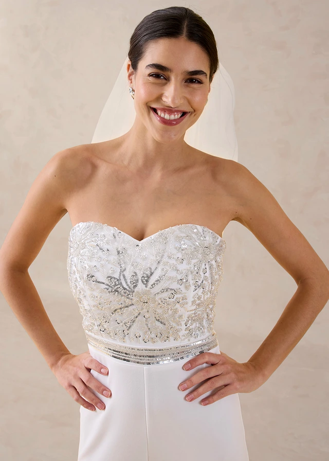 Jumpsuit van gestructureerde crêpe met parelborduursel • wolwit • product-page.page-title-suffix