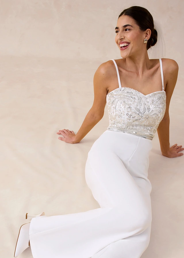 Jumpsuit van gestructureerde crêpe met parelborduursel • wolwit • product-page.page-title-suffix