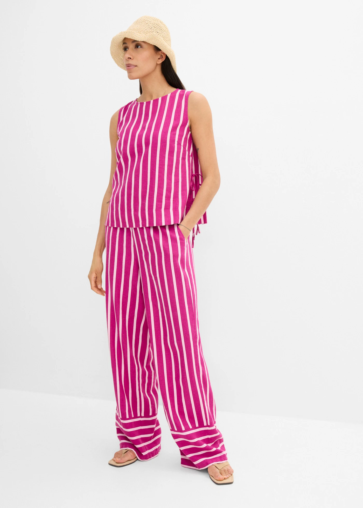 Spodnie w paski z gumką w talii • fuksjowy róż-jasnoróżowy w pionowe paski • sklep bonprix