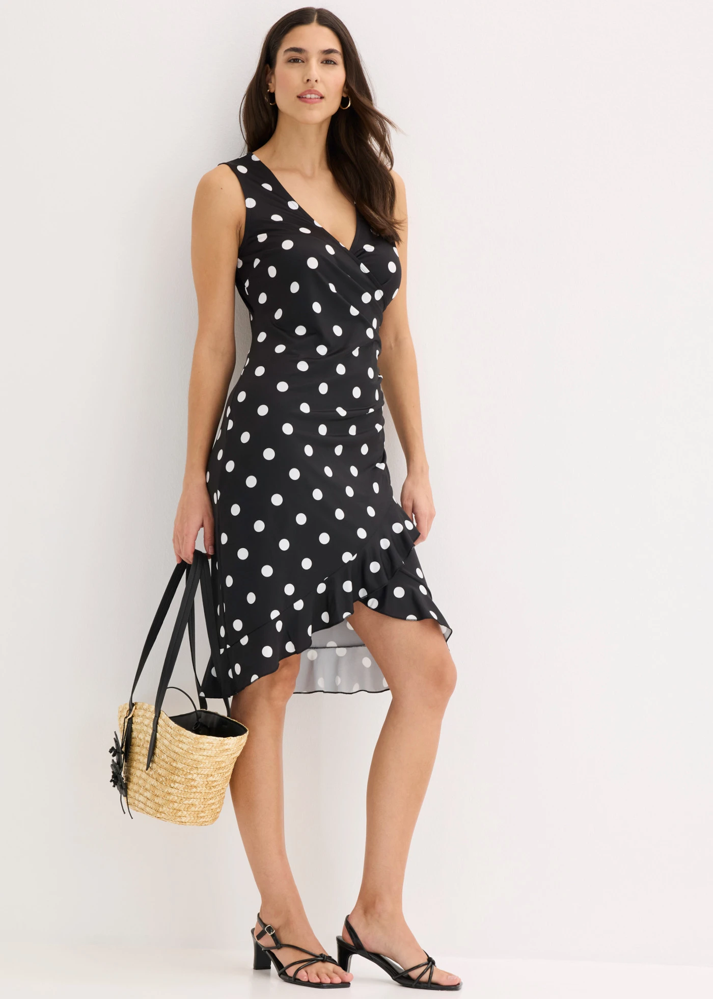 Jersey jurk met diep decolleté • zwart-wit gestippeld • bonprix online shop