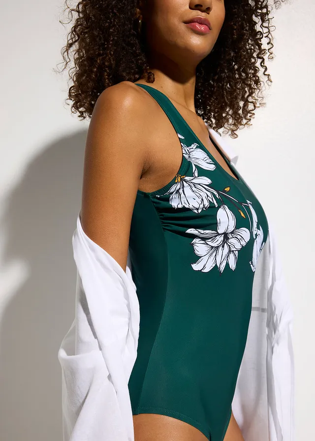 Costum de baie cu efect ușor modelator • verde profund înflorat • magazin bonprix