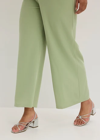 Salopetă din material cu textură crep • verde pal plus size • magazin bonprix