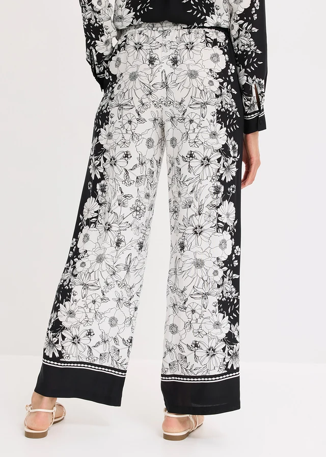 Pantaloni palazzo din viscoză fluidă • negru-ecru floral • magazin bonprix