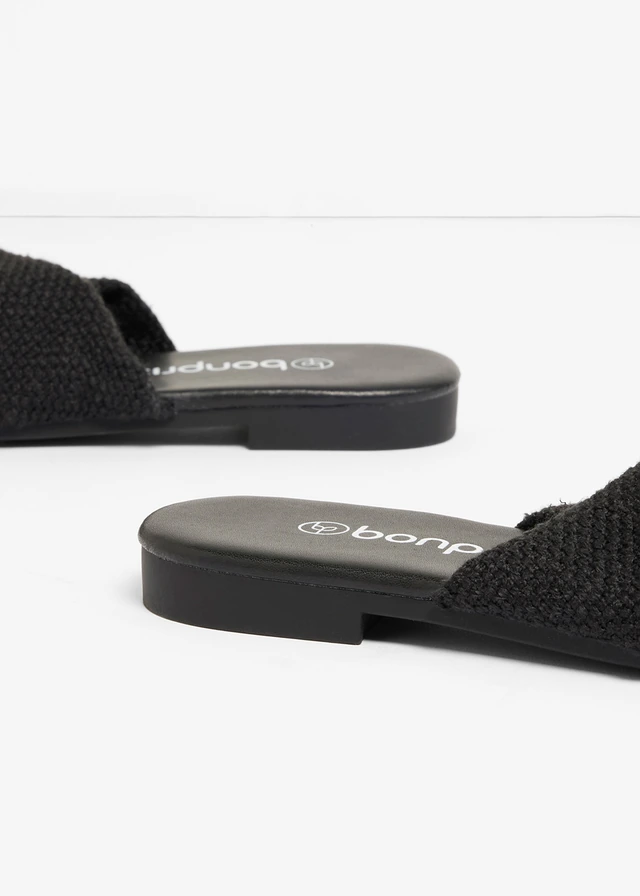 Slippers met een knoopdetail • zwart • product-page.page-title-suffix