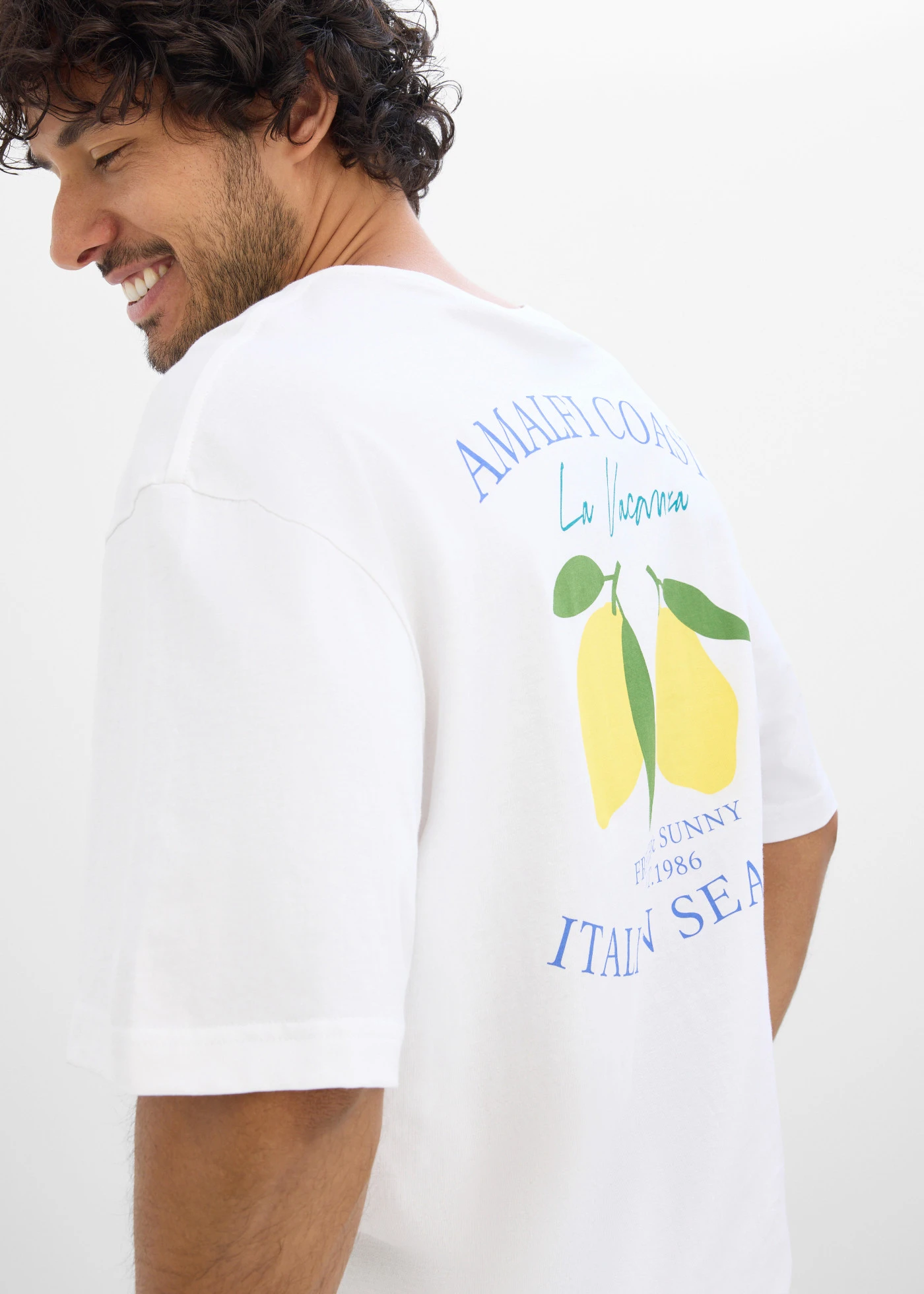 T-shirt z czystej bawełny organicznej, loose fit • biały z nadrukiem • sklep bonprix